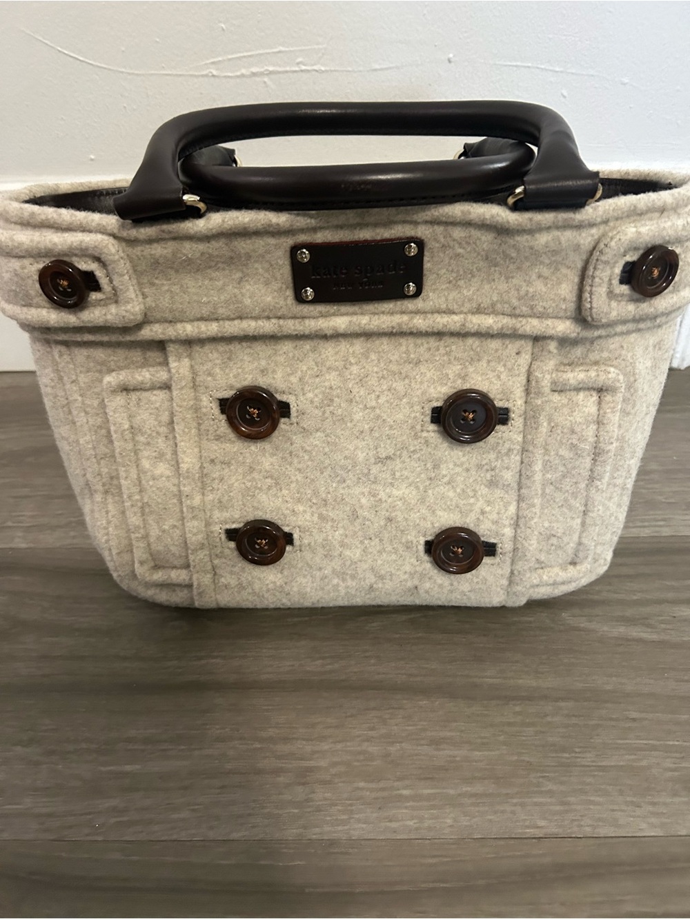 Kate Spade New York gray felt tote bag with black buttons and black handle